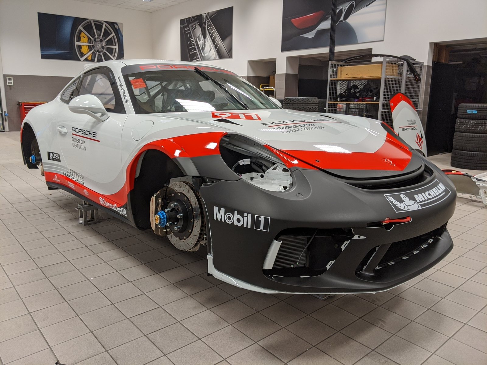 Race car wrapped in white, red and black vinyl